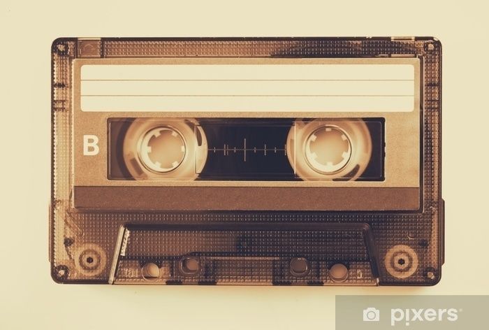 Vintage transparent cassette tape with a blank label and visible reels
